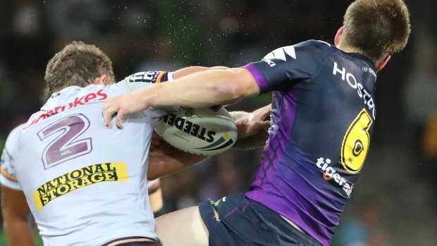 Cameron Munster of the Storm injures his jaw in a tackle on Corey Oates.