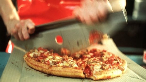 Domino's may have to share more profit with franchisees, which would hurt its returns.