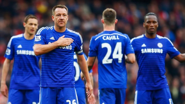 True Blues: John Terry of Chelsea celebrates with team mates after the match against Arsenal.