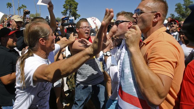 Donald Trump supporters clash with protesters at a rally in Fountain Hills, Arizona on Saturday.