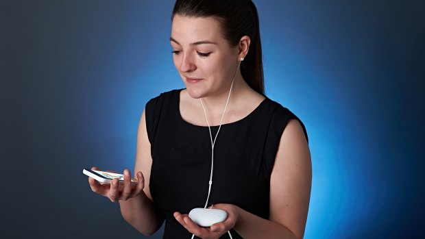 That person wearing ear-buds, apparently texting in the corner of the pub? She might well be recalibrating her hearing aids so she can better make out conversations above the background hubbub.