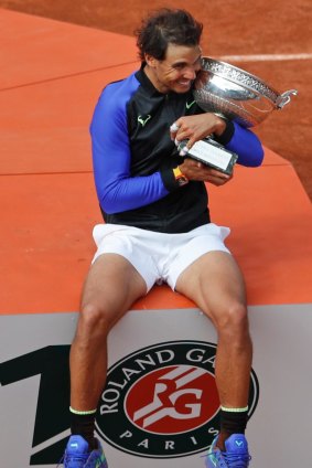 Spain's Rafael Nadal celebrates winning his tenth French Open title.