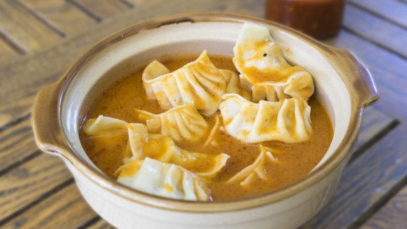 Jhol momo, momo dumplings in spicy soup.