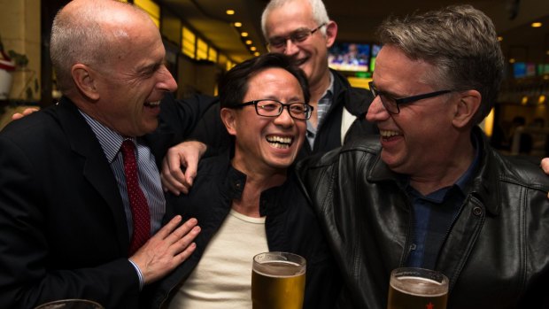 Matthew Ng, centre, celebrates his release from jail with his lawyer, Tom Lennox, left, and friends from his days studying at the Australian Graduate School of Management.