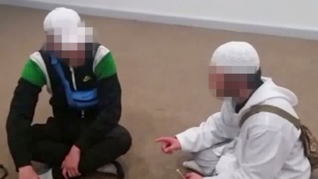 One of the boys, in white, uploaded videos of him converting other young people to Islam.