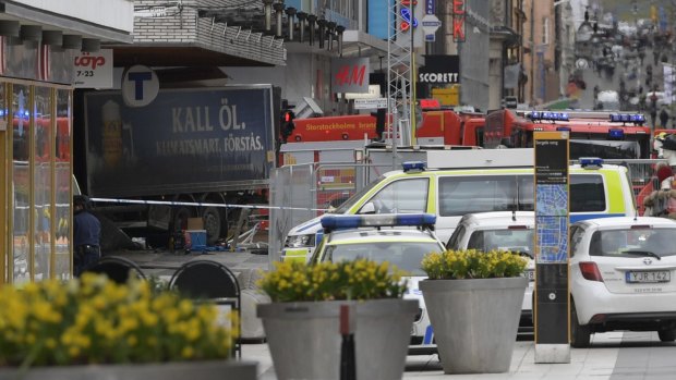 A truck after it came to rest in a Stockholm department store after killing three people en route.