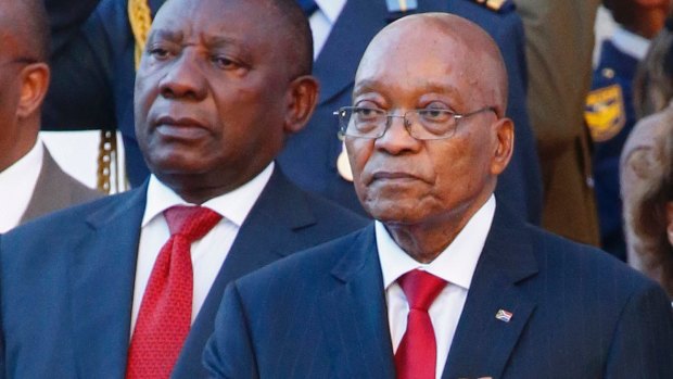 South Africa's outgoing President Jacob Zuma (right), alongside incoming leader Cyril Ramaphosa.