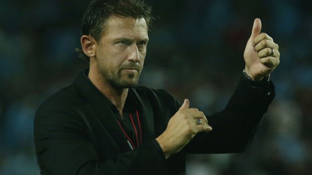 Upbeat: Tony Popovic acknowledges the crowd after the match.