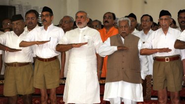 Loyal cadre: then Gujurat chief minister Narendra Modi attend an RSS rally in Adalaj, Gujarat, in September 2009.