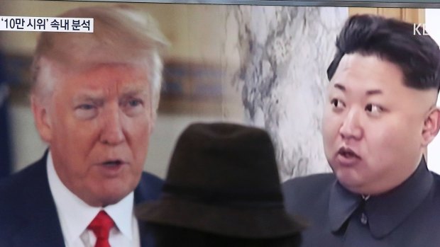 A man watches a television screen showing U.S. President Donald Trump, left, and North Korean leader Kim Jong-un during a news program at the Seoul Train Station in Seoul, South Korea.