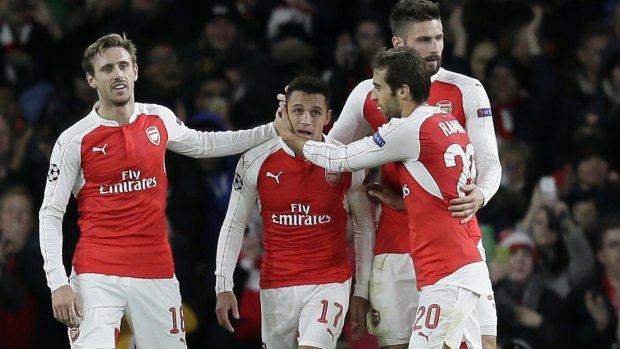 Arsenal's Alexis Sanchez (centre) celebrates one of his two goals with teammates during the Champions League match between Arsenal and Dinamo Zagreb.