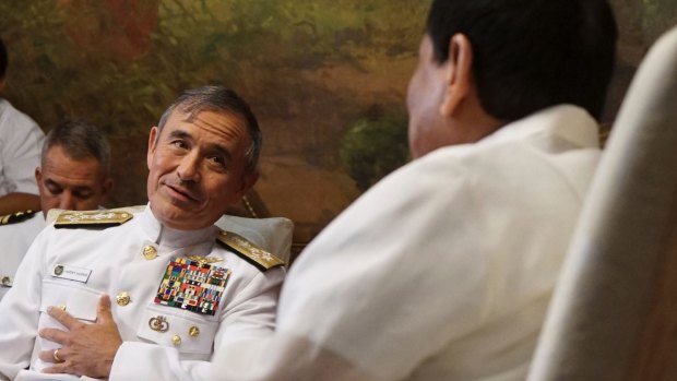 Philippine President Rodrigo Duterte, right, receives US Pacific Command Commander Admiral Harry Harris during a courtesy call in August in Manila.
