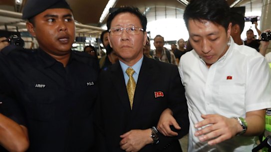 North Korea's Ambassador to Malaysia Kang Chol, centre, arrives at Kuala Lumpur International Airport.