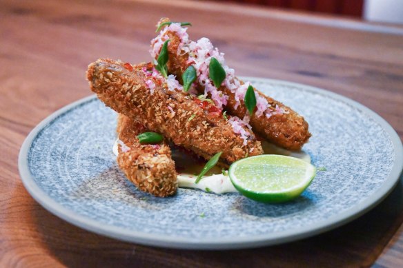 Crumbed fried lamb short ribs with honey, chilli, rosemary and hung buffalo milk yoghurt.