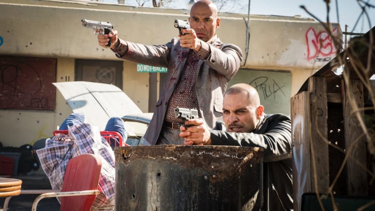 Here's trouble: Nacho Varga (Michael Mando, crouching) has fallen in with the shiny suited Salamanca assassins.