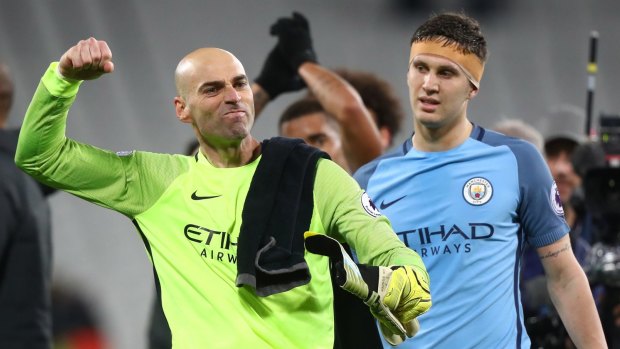 Man City's Willy Caballero and John Stones celebrate after beating West Ham.