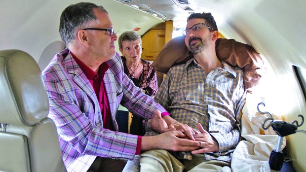 "I now pronounce you husband and husband," said officiant Paulette Roberts as Jim Obergefell, left, and John Arthur are married on the tarmac of Signature Flight Support at Baltimore/Washington International Thurgood Marshall Airport.