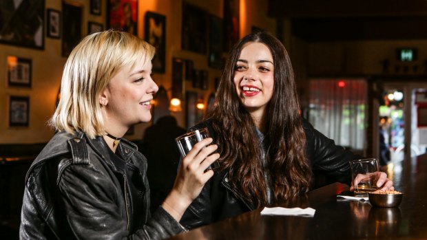 Rebecca Victoria, left, and Ellie Hayes-O'Brien enjoy a whisky at Earls Juke Joint on King Street, in Newtown. 