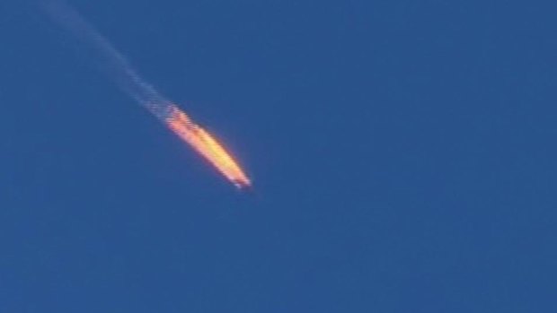 The Russian warplane on fire before crashing.
