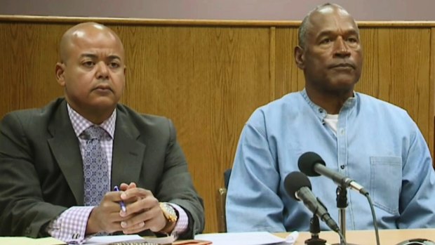 OJ Simpson with his attorney, Malcolm LaVergne, left, appearing via video for his parole hearing.