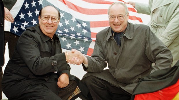 Elvis Presley's former road manager and friend Joe Esposito, left, shakes hands with Bremerhaven mayor Manfred Richter at the point Elvis stepped on German soil, 1998.