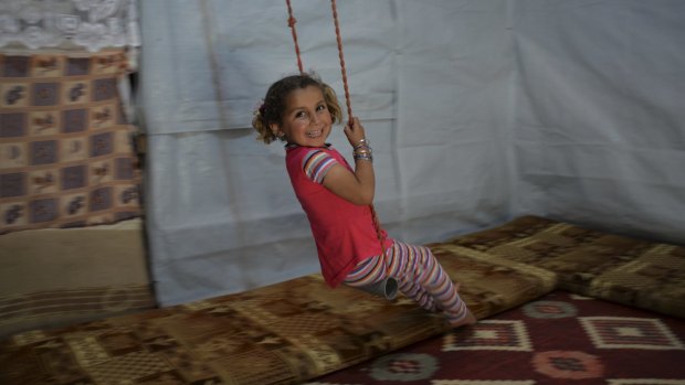 She might live in a refugee camp but like children everywhere, Reem, 4, still seizes every opportunity to play.  