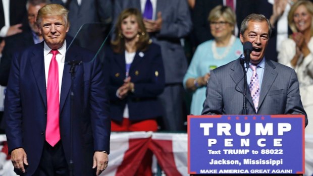 Nigel Farage, ex-leader of the British UKIP party, speaks as Republican presidential candidate Donald Trump, left, listens, at Trump's campaign rally in Jackson, Mississippi.