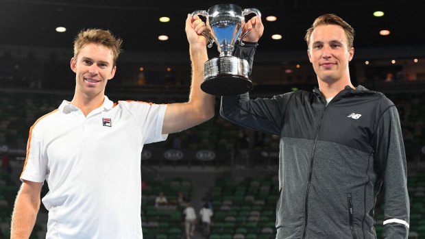 John Peers and Henri Kontinen pose with the trophy.
