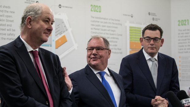 Lord Mayor Robert Doyle flanked by Planning Minister Richard Wynne (left) and Premier Daniel Andrews (right) at the market last month. 