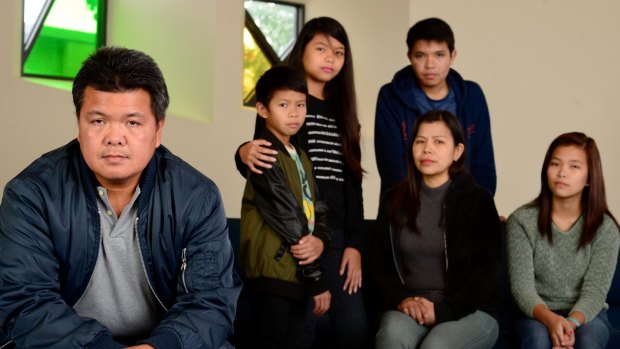 Antonio Enriquez (left) with his family.