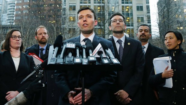 Washington state Solicitor-General Noah Purcell talks to reporters following the judge's ruling.