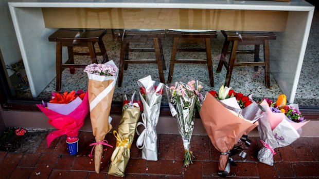 Tributes for Joseph Acquaro in front of his Brunswick East cafe on Wednesday.