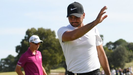 'It is what it is': Jason Day acknowledges the crowd as he walks off the 18th green to end a frustrating round.