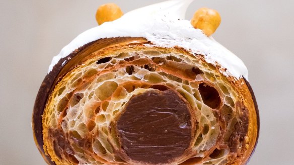 A Supermoon croissant filled with hazelnut praline and dark chocolate ganache.