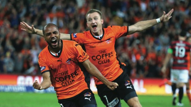 Roar emotion: Henrique and Besart Berisha celebrate the winner in the 2014 A-League decider.