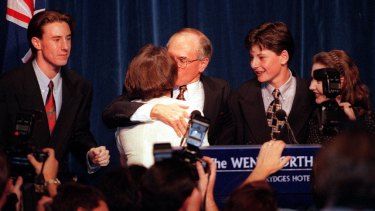 John Howard kisses his wife Janette following his election as prime minister in 1996.