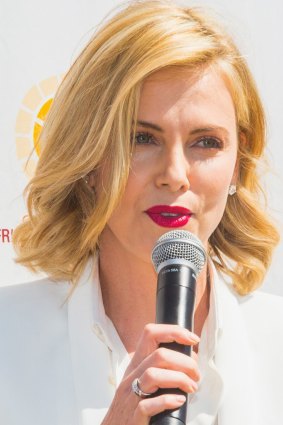 Charlize Theron flew in to Melbourne's Grand Prix to promote the $300 million, luxury Capitol Grand apartments.