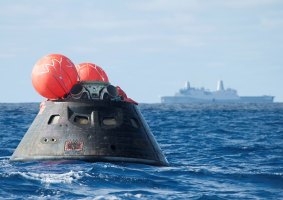 Splash down: Orion awaits the USS Anchorage. 