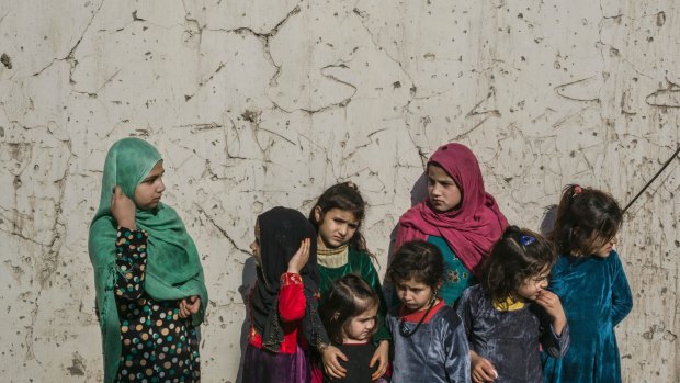 Meena, 11, left, with other children who live in the women's wing of the Nangarhar provincial prison, in Jalalabad, Afghanistan. 