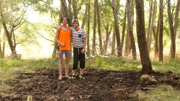 Ryan Phillips and Kieran Guise at the sight of a small spot fire at Umbagong District Park