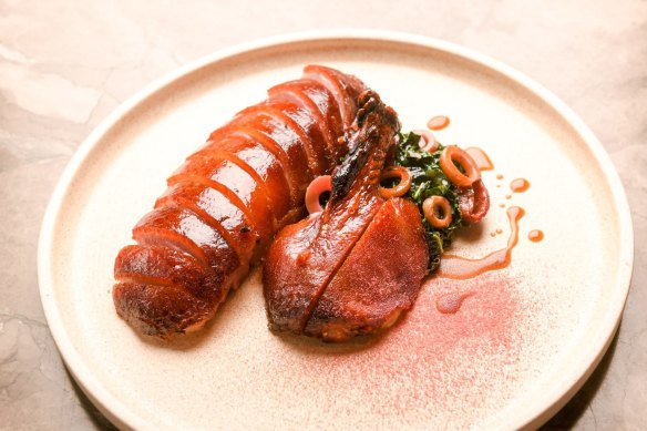 Dry-aged roast duck with quandong, black cabbage and bamboo.