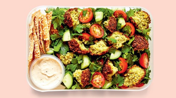 It's easy to make your own pita chips for this falafel salad.