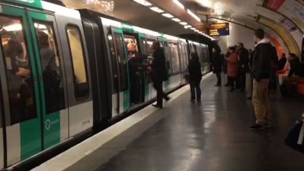 A video grab shows Chelsea football fans packed on to a Paris Metro train pushing a black man to prevent him from boarding.