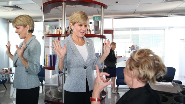 Minister for Foreign Affairs and deputy leader of the Liberal Party  Julie Bishop surprises Colleen Bliim at the hairdressers.