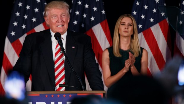 Ivanka Trump listens as her father delivers a policy speech. 