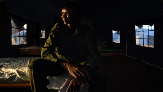 Australian South Sudanese Makuer Mabor Mangar, a Sudan People's Liberation Army (SPLA) IO soldier, inside his tent on the outskirts of Juba, South Sudan.  