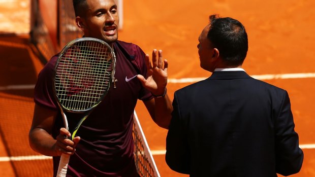 Nick Kyrgios argues with match umpire Mohamed Lahyani during his straight sets victory.