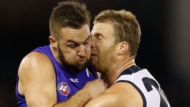 Getting to know you: Lachie Henderson clashes with Bulldog Matt Suckling on Saturday night.
