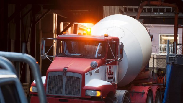 A cement truck delivering cement to a building site in the Melbourne CBD.