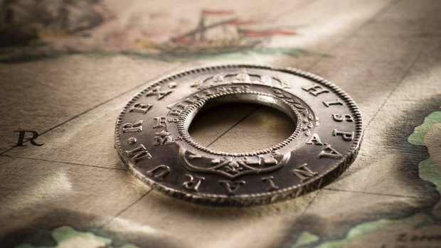 Lachlan Macquarie modified Spanish coins to create Holey Dollars, Australia's first coins.